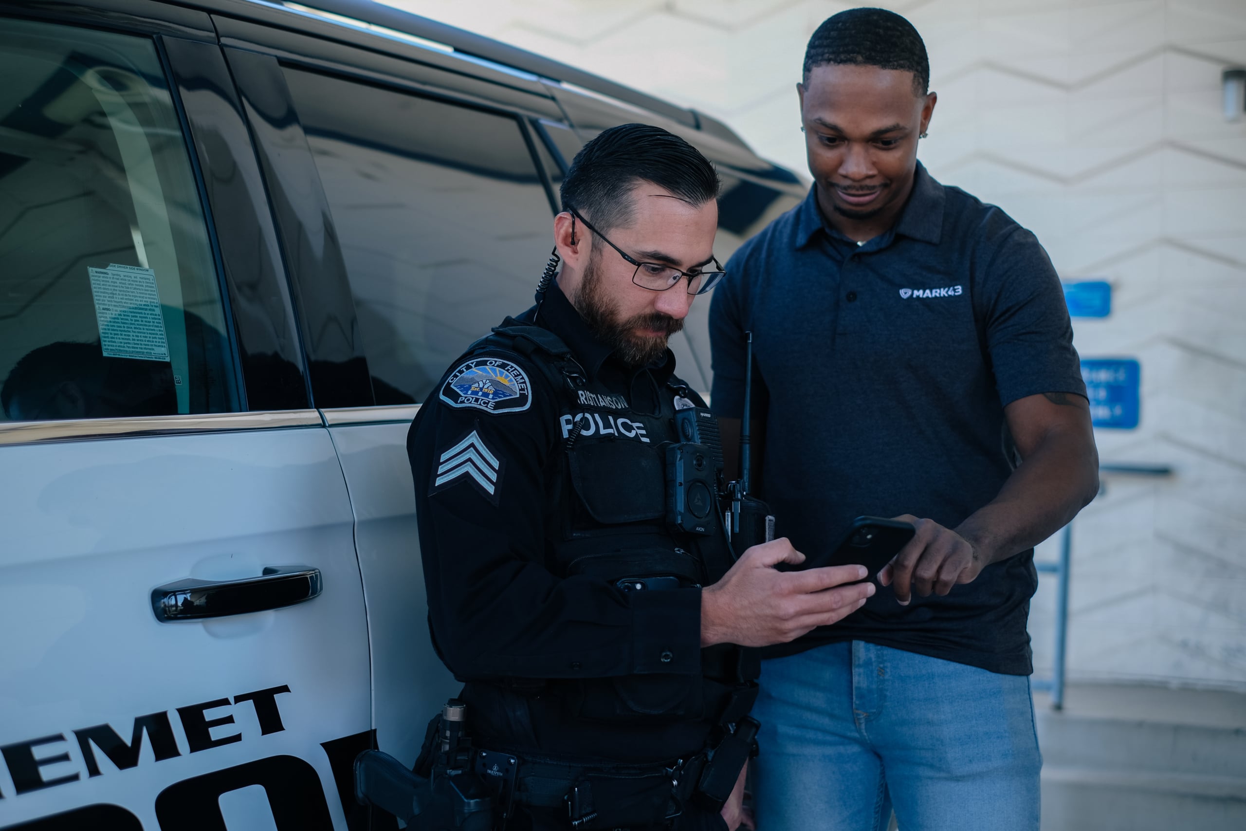 a police officer working with a Mark43 team member