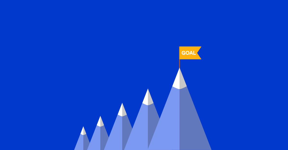 a row of mountains with a yellow goal flag on the tallest one