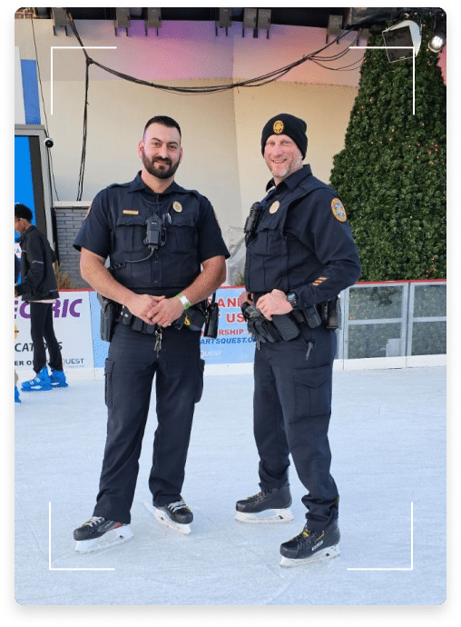 two police officers smiling for a photo