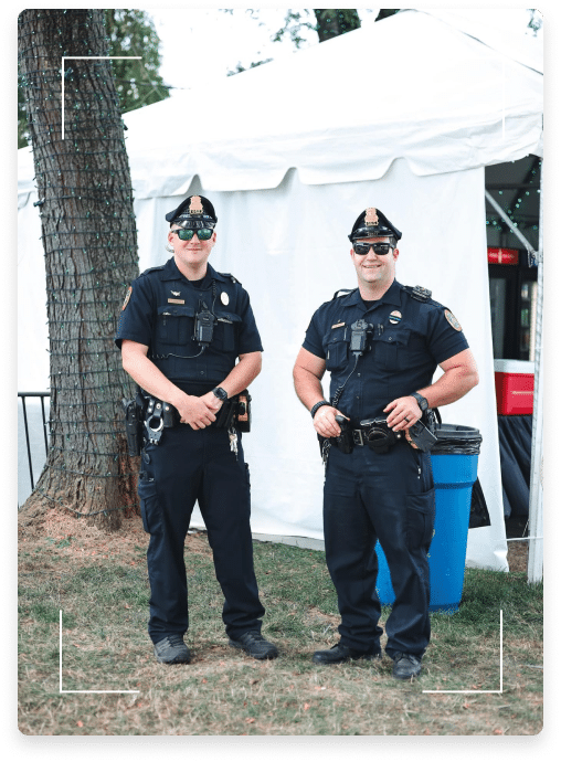two police officers smiling for a photo