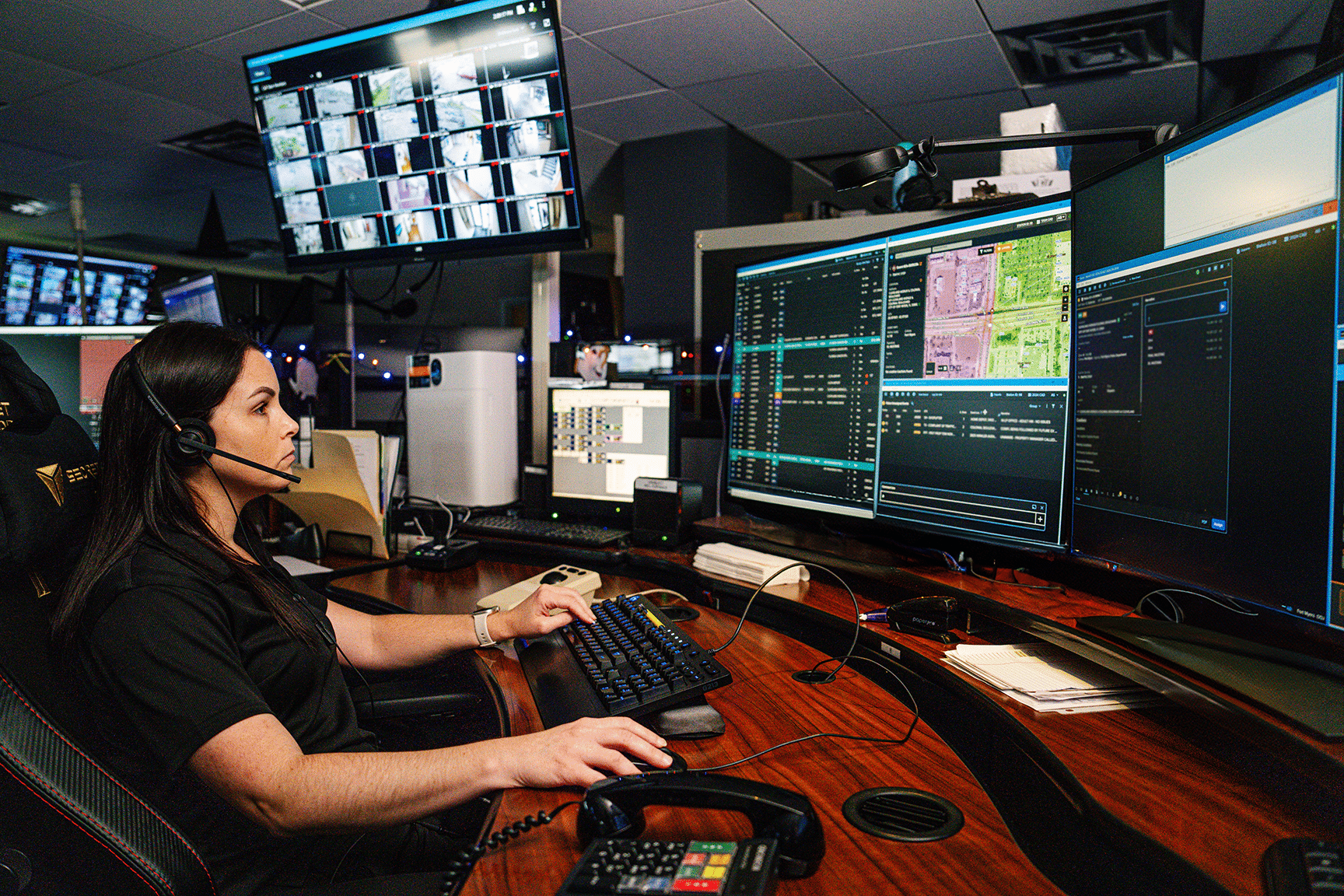medical dispatcher working on her computers