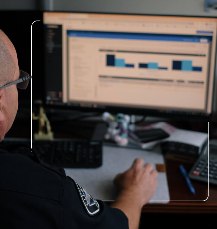 a police officer working on his computer