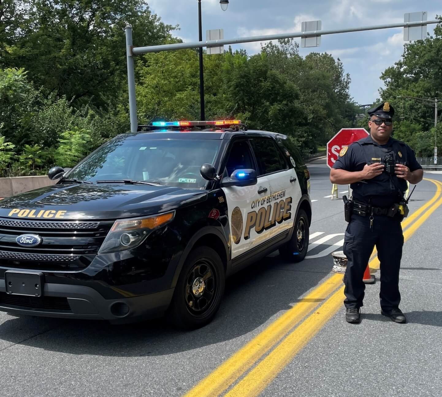 a police officer standing next to his police vehicle