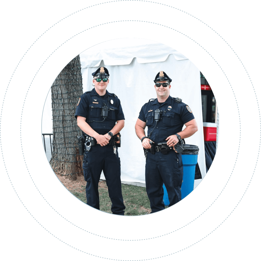 two police officers smiling for a photo