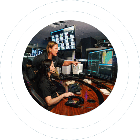 two dispatchers working on the computer together