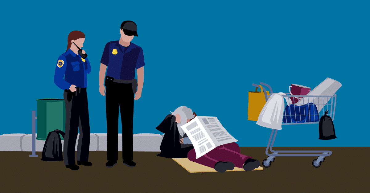 two police officers checking on a person living on the streets