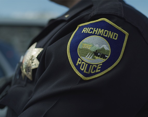 a police officer wearing a Richmond Police badge