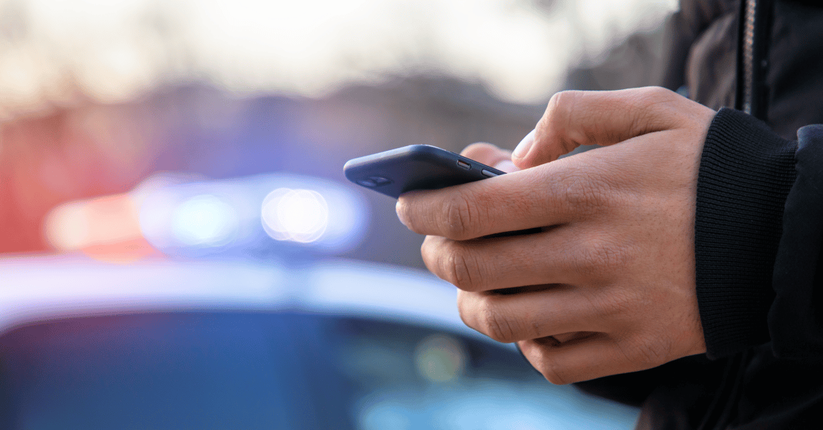 a person texting on a smart phone